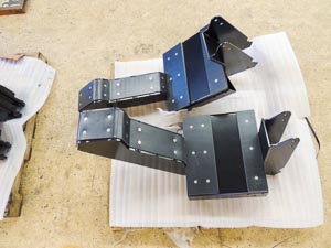Boom cradle for agricultural spray booms