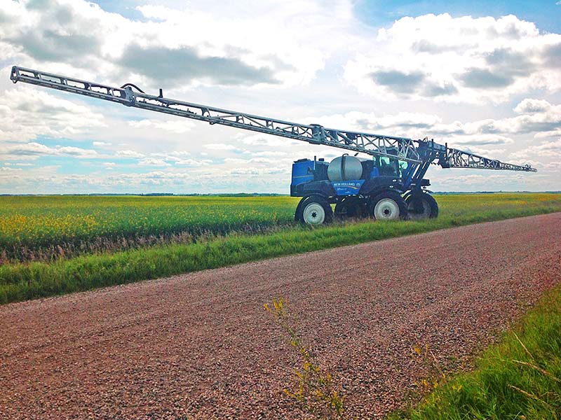 New Holland 240XP with 132' Millennium aluminum spray booms