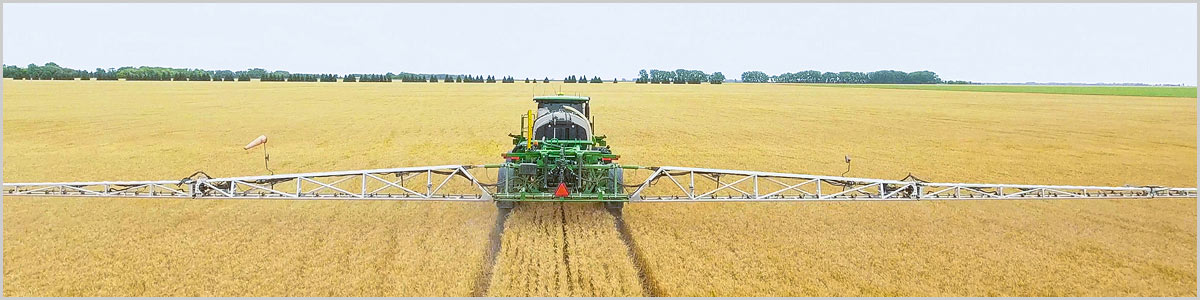 Millennium sprayer booms loaded on trailer for transport
